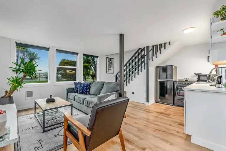 Open living room and kitchen in Tidal House Chalet 7.